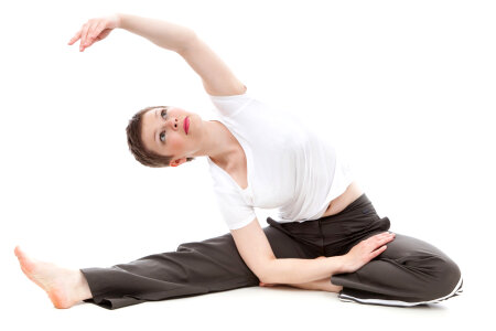 Flexible athletic woman stretching photo