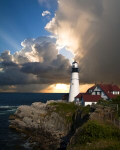 Seascape at sunset. Lighthouse on the coast photo