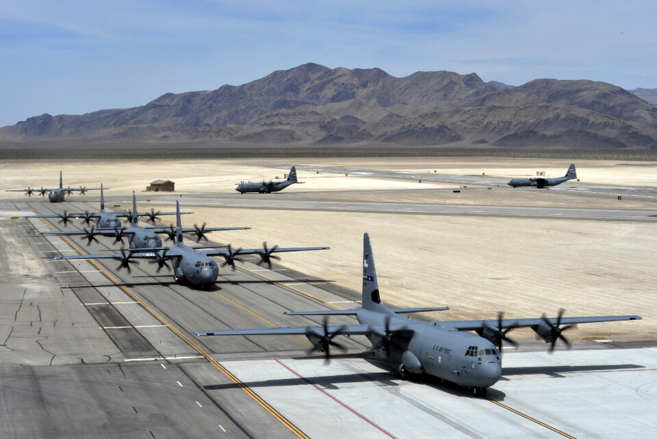 Seven C-130J Super Hercules taxi after landing