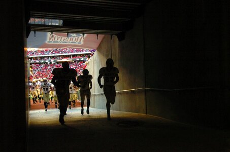 Football Player running out of the Stadium Tunnel