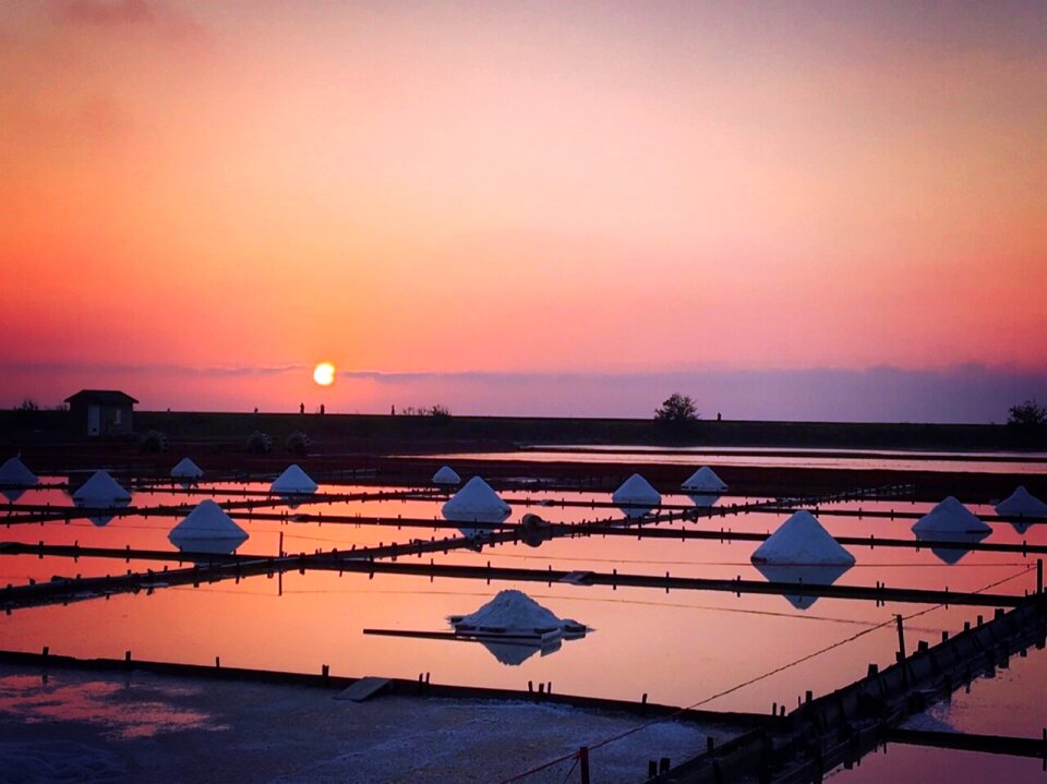 Colorful sunset over salterns