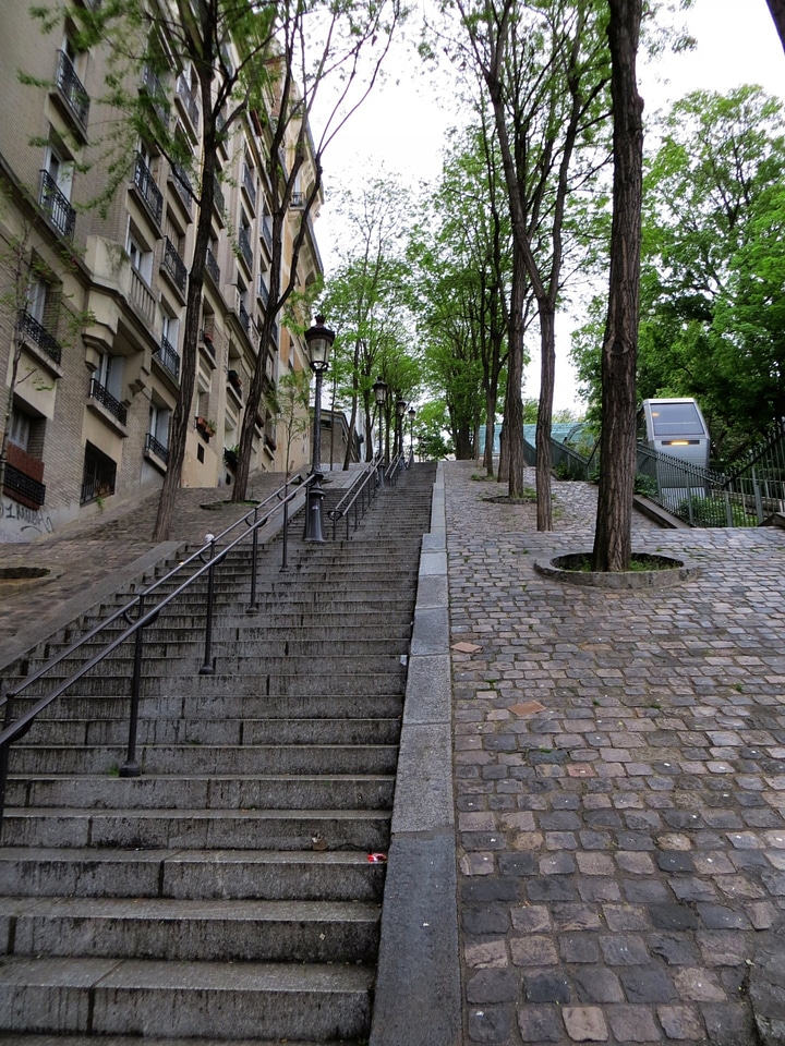 Cobblestones climb railing