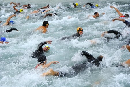 group people swimming at triathlon photo