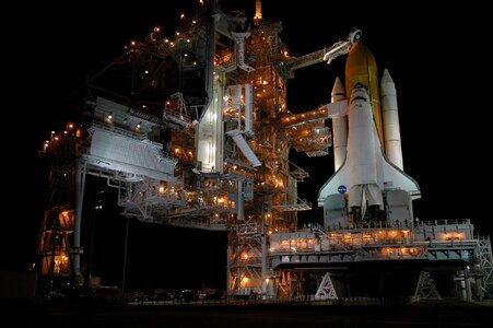 Space Shuttle Discovery at night photo