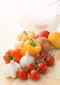 A medley of fresh vegetables, including tomatoes,pepper