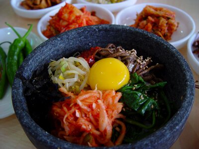 bibimbap in a heated stone bowl, korean dish