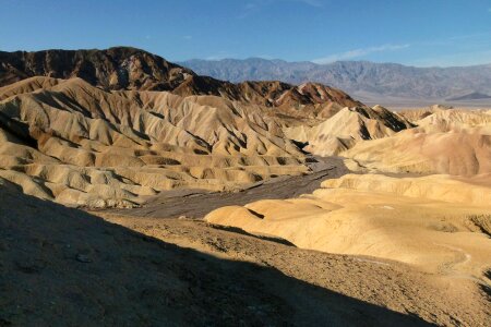 Moon Over Zabriskie Point Mudstones form Badlands Death Valley