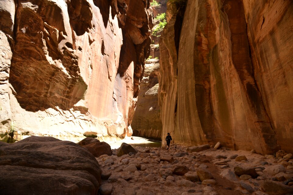 Group Of Tourists Hiking In The Cold River