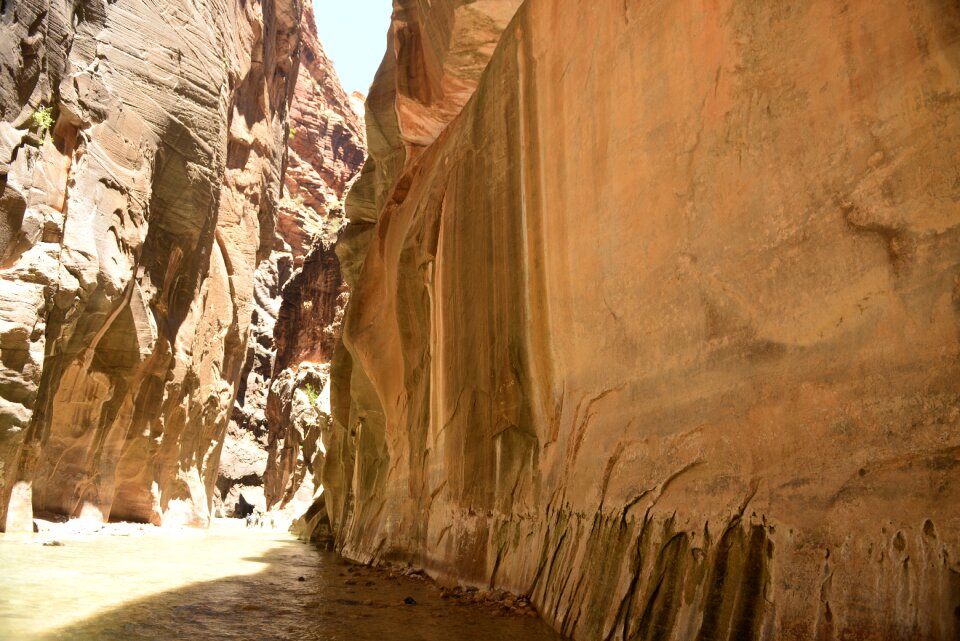 Group Of Tourists Hiking In The Cold River