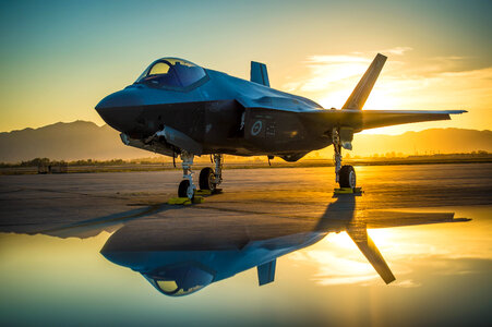 The sun sets behind an Australian F-35A Lighting II aircraft