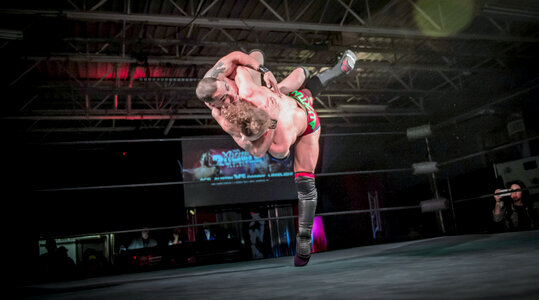 Two Men Battle for Control in Wrestling Match