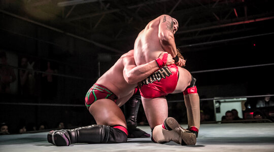 Two Men Battle for Control in Wrestling Match