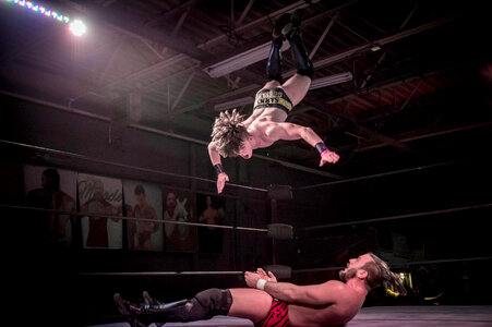 Two Men Battle for Control in Wrestling Match