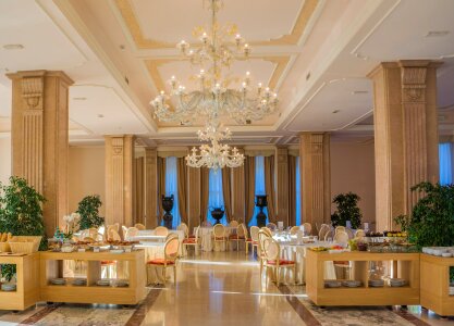 Interior of a restaurant in a hotel, during evening. photo