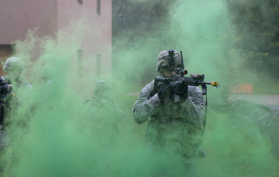 green smoke cover during building clearance training