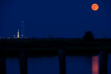 Antares Rocket With Full Moon photo