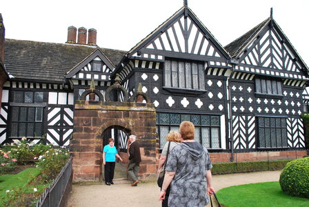 Black and white timber framed medieval mansion house and gardens. photo