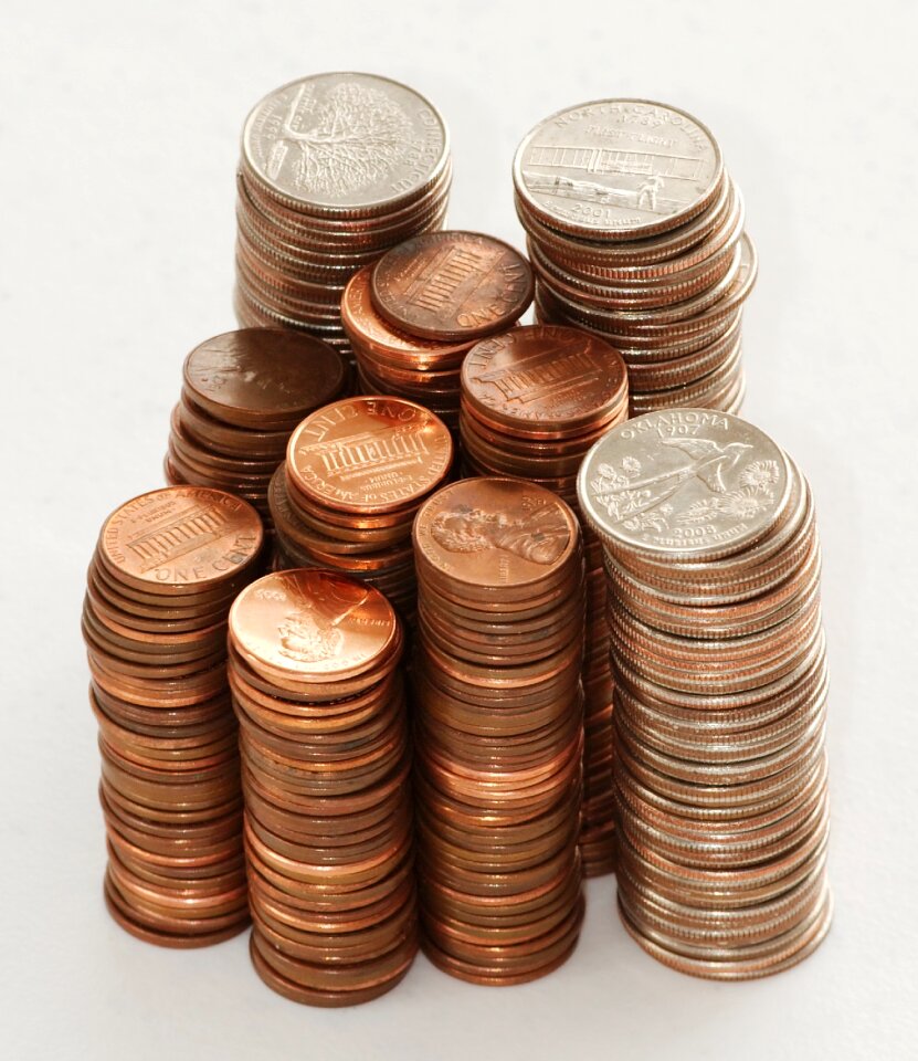 Stacks of US quarters and pennies