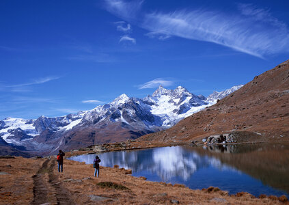 scenery of high mountain with lake and high peak photo