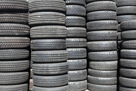 used car tires pile in the tire repair shop yard