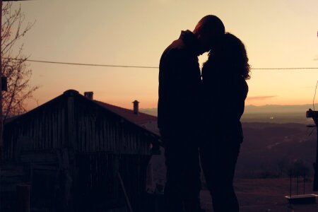 Couple in love silhouette during sunset photo