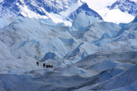 a group of trekking tour on a huge glacier ice in patagonia photo