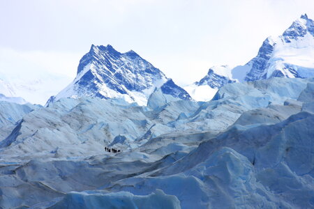 a group of trekking tour on a huge glacier ice in patagonia