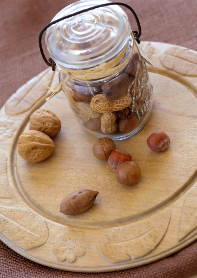 Large diversity of healthy nuts in glass bottle