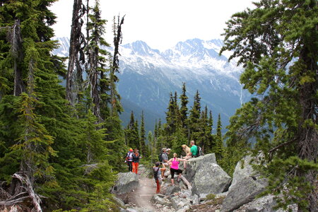 Beautiful landscape with group of tourists hiking in Rocky