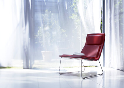 Comfort red chair background big window photo