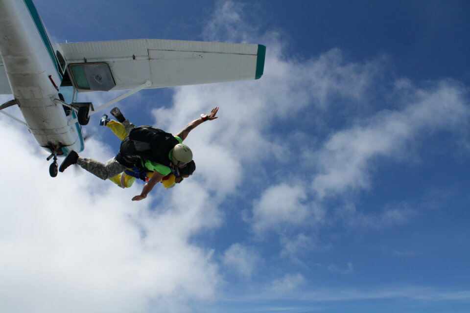 Skydiver falls through the air. Parachuting is fun