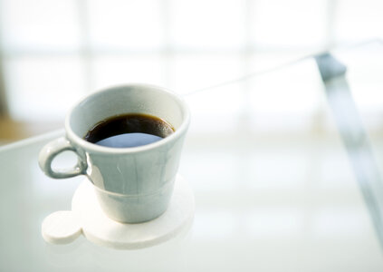 Cup of fresh coffee on table photo