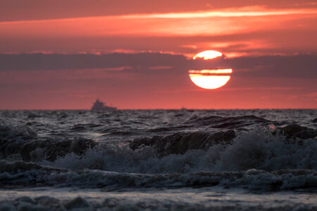 warm sunset over sand beach on North sea