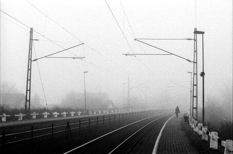 railway system with rails in dense fog photo