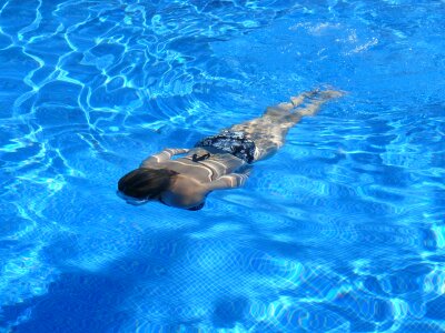 professional swimmer underwater photo