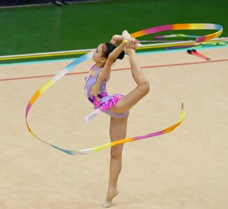 Beautiful rhythmic gymnast in professional arena