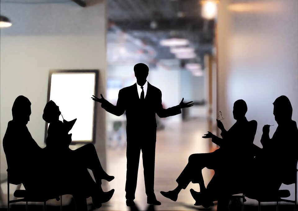 Group of Business People Meeting in Back Lit photo