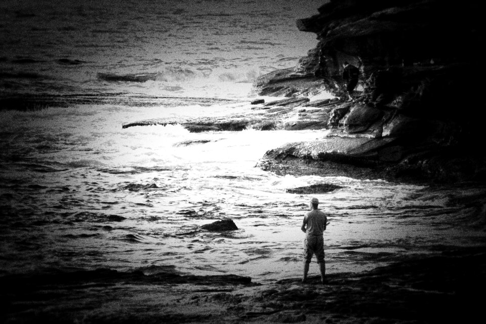 man fishing on the sea with fair sun light early in the morning