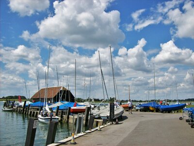 Bosham quay at high tide with ferry boat photo