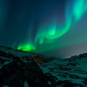 Night sky with amazing northern lights aurora borealis photo