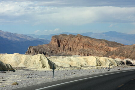 Long desert highway leading into Death Valley National Park photo