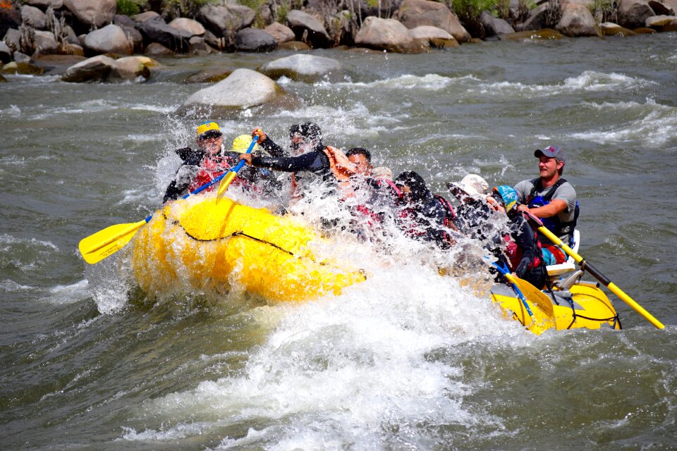 Group of happy people rafting
