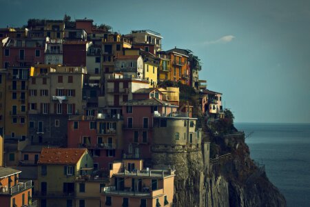 Traditional houses above the sea in Manarola, Cinque Terre, Italy photo