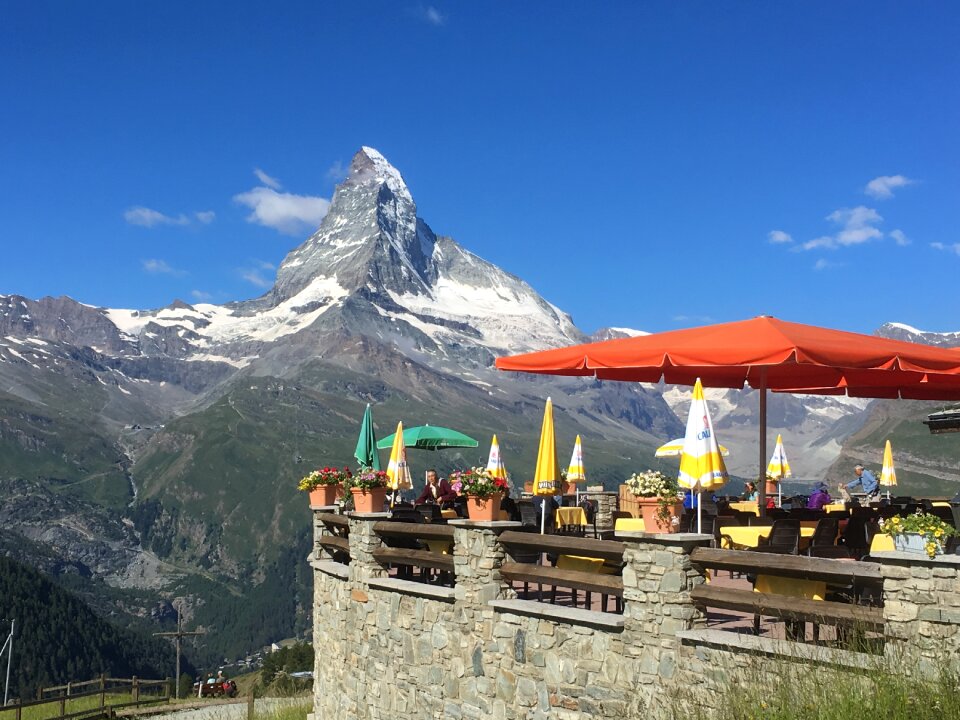 Tourist taking view of Matterhorn in autumn at outside restaurant
