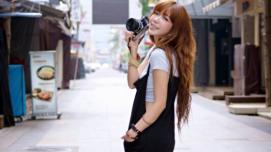 Taiwanese woman with a digital camera photo
