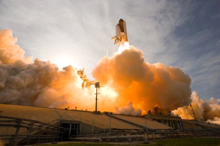 Space shuttle taking off on a mission photo