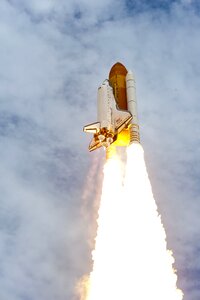 Space shuttle taking off on a mission photo