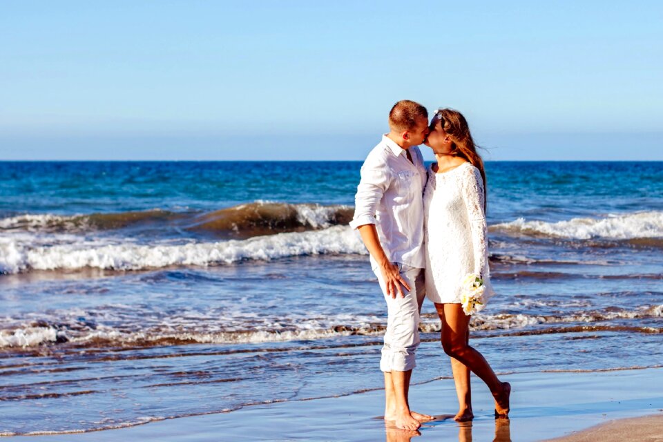 romantic couple kissing on beach