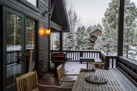 Rear view of home with enclosed porch