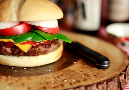Homemade cheese burger or hamburger on wood plate photo